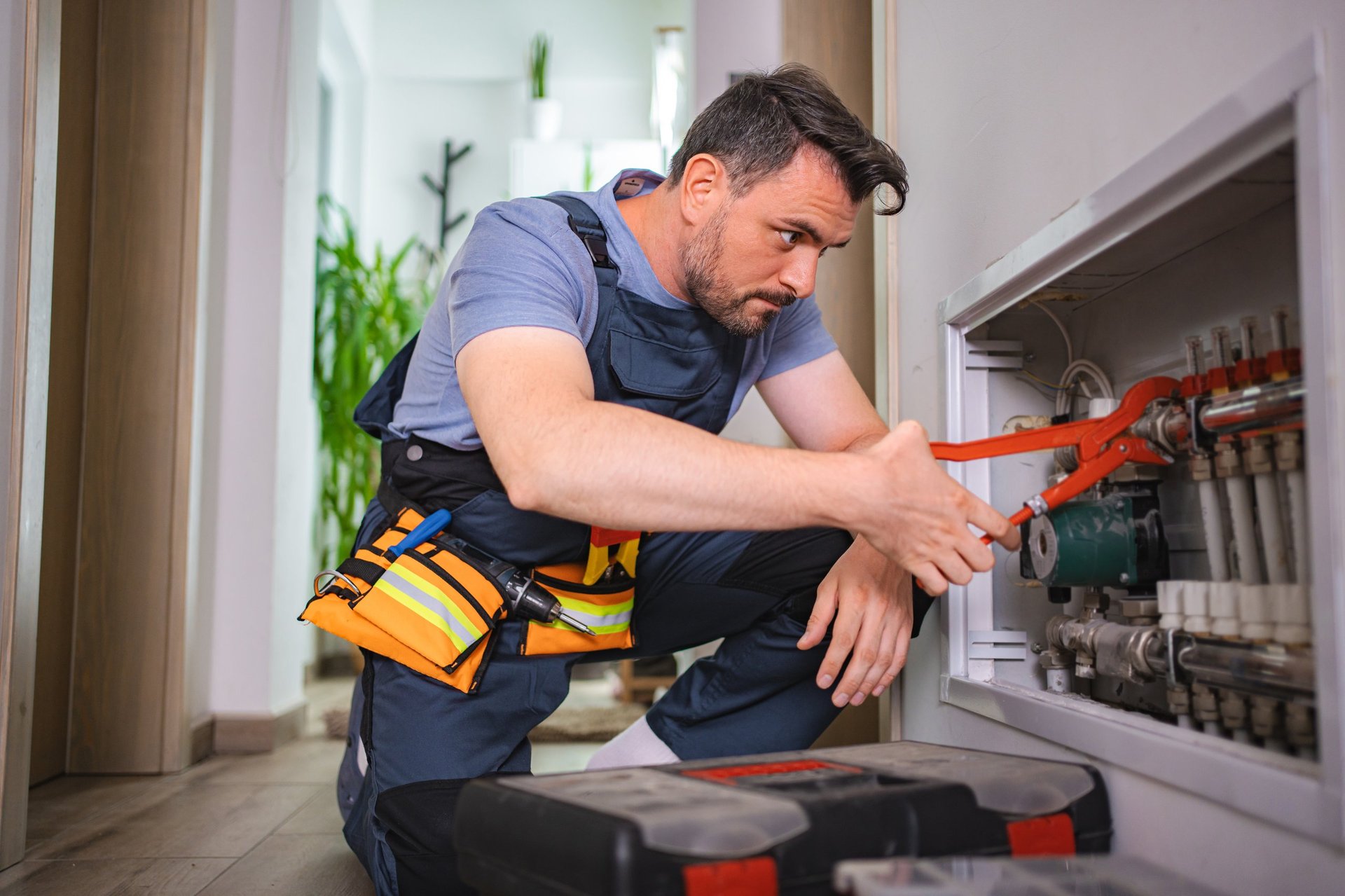 Professional technician repairing heating system